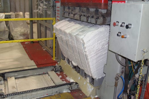 Completed cotton bale being pushed from a Cotton bale press in south Georgia.