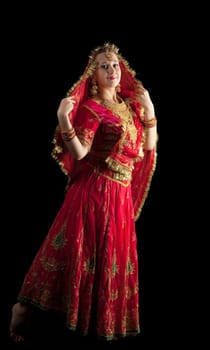young girl dance in gorgeous red indian oriental costume
