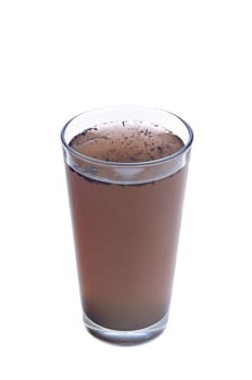 Dirty water in glass isolated on white background