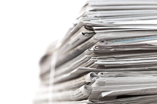 Big stack of newspapers on white background