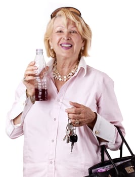 Senior Woman with bottle of juice and House/Car Key in her Hand (isolated on white)
