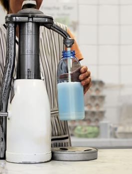 Fresh Bottle Milk from Milkpump in Dairy Farm Shop