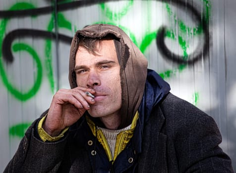 Homeless Men Being Friendly smokes a cigarette Outdoor