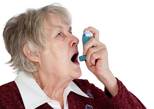 Senior woman with asthma inhaler, isolated on white