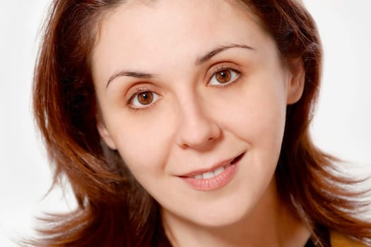 Happy young woman smiling headshot with friendly look