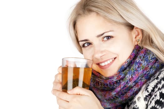 Young woman with a cup of tea isolated on white