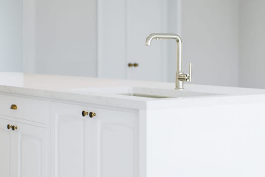 View of the sink. Kitchen island with white cabinets. 3D rendering.