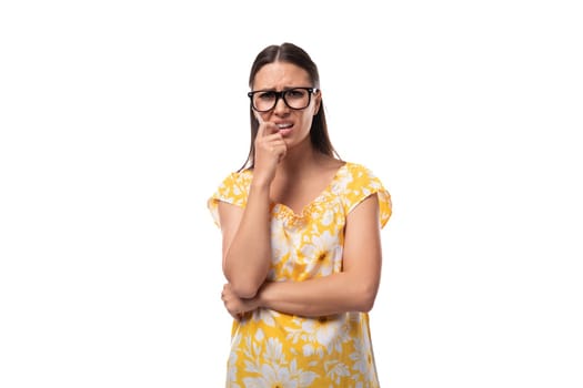 portrait of a slender young woman with glasses for vision correction on a white background.