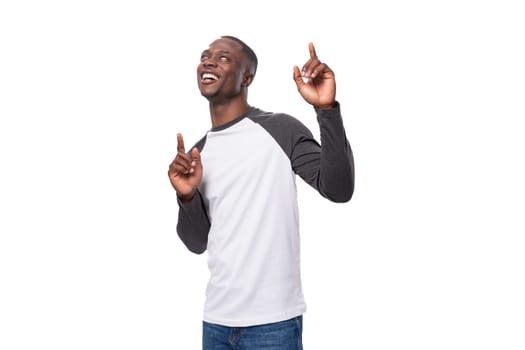 young cheerful businessman american man dressed casually happy on white background.