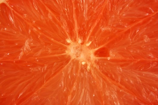A Pink grapefruit half background texture