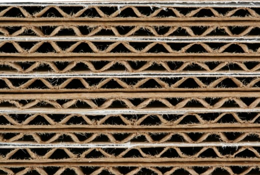 A Stacked corrugated cardboard boxes macro background