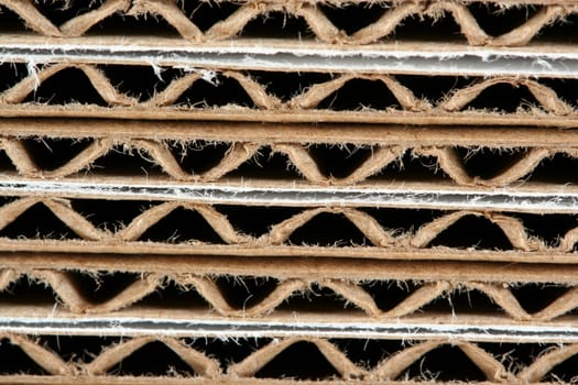 A Stacked corrugated cardboard boxes macro background