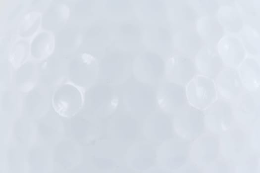 A White golf ball macro backround