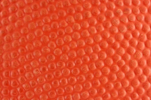 A Orange rubber basketball macro background