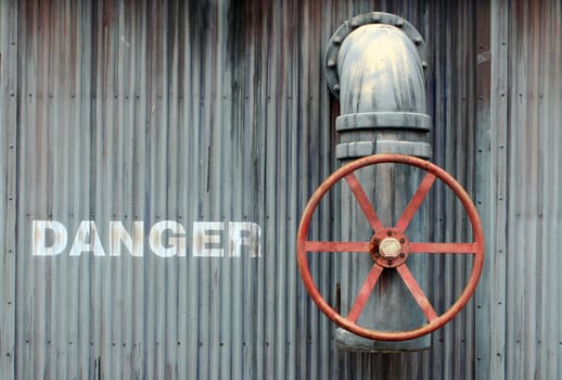 A Large wheel valve with danger