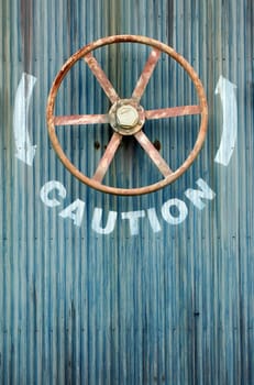 A Large wheel valve with caution