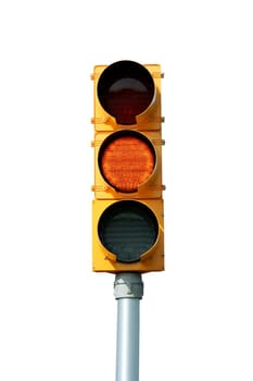 Isolated yellow traffic signal light on white
