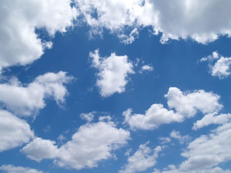 White puffy clouds in a blue sky