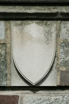 A old blank shield on a building