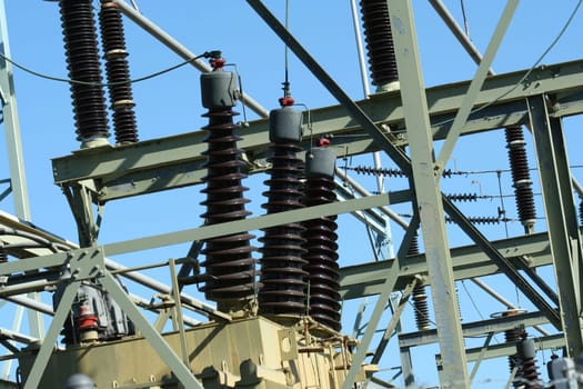 Power line substation against blue sky