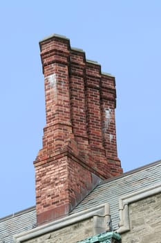 Some old chimneys on a roof