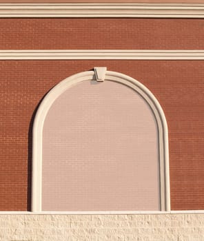 Ornate Roman styled brick wall with curved molding and a reduced opacity brick copy space.