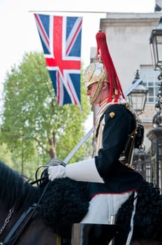 London, England - April 24, 2011: A mounted horse guard stands guards outside the horse guards parade in London.