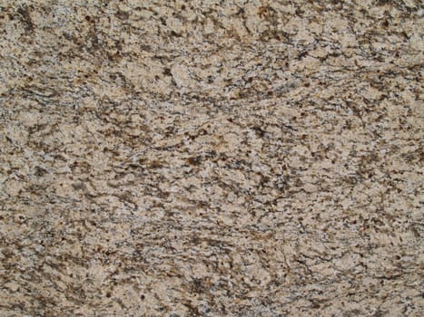 Speckled brown and tan marble grunge texture.