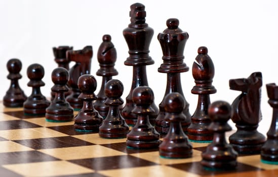 Chess pieces on a board with white background