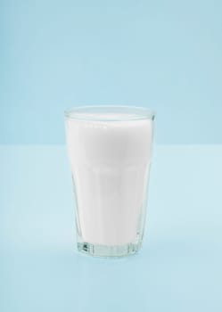 Glass of fresh milk on the kitchen table
