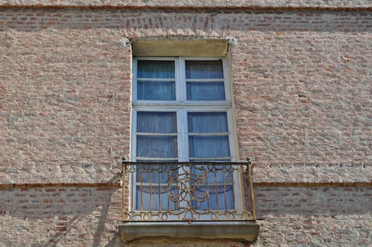 An old window in an ancient wall