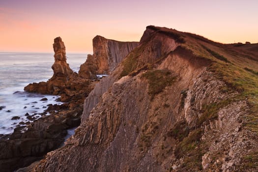 Amazing seascape sunrise at winter. Los Urros, Spain