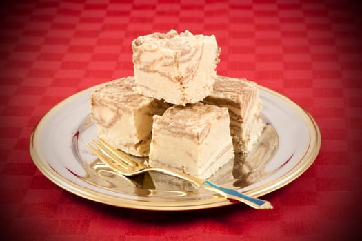 Delicious Halva served in silver-golden dish. Vignetting effect applied.