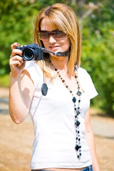 beautiful young woman taking photos