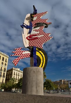El Cap de Barcelona, 1991-1992, is a surrealist sculpture created by American Pop artist Roy Lichtenstein for the 1992 games in Barcelona, Spain. Its English title is "The Head"".  The sculpture was Lichtenstein&#039 s first outdoor work using ce"