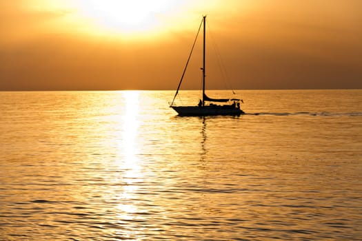 Sailboat at dawn, taken from Barcelona on the Mediterranean sea.