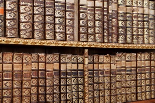 Old antique books,with hard cover on a shelf
