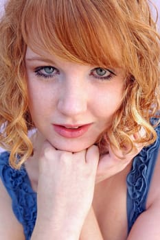 Young redhead girl with freckles