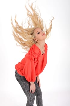 Young pretty teenage girl in studio with long hair