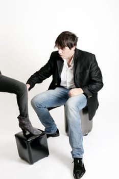 Young teenager male in studio, brown hair, white background
