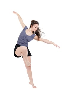 Young pretty teenage girl brunette dancing in studio with long hair