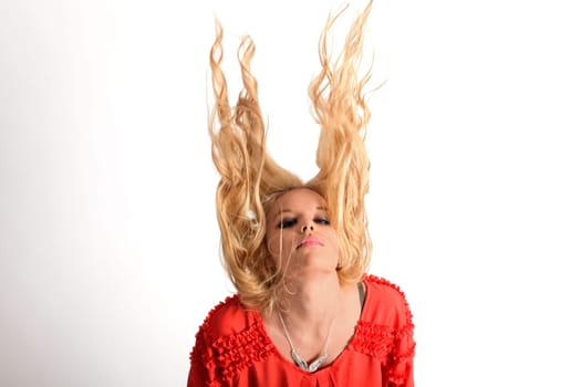 Young pretty teenage girl in studio with long hair