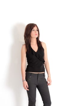 Young pretty teenage girl brunette in studio with long hair