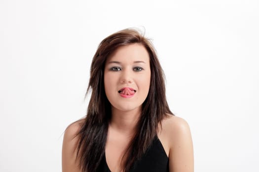 Young pretty teenage girl brunette in studio with long hair