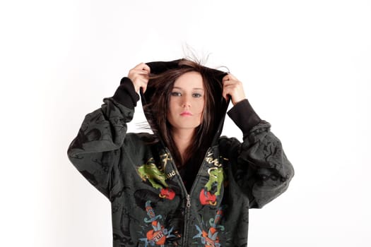 Young pretty teenage girl brunette in studio with long hair