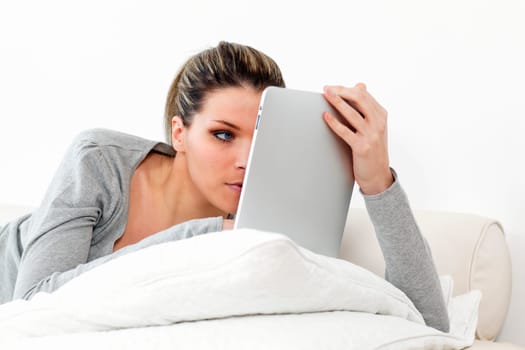 woman on sofa with tablet