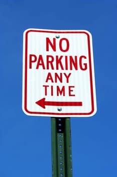 No Parking sign with blue sky