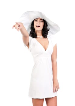 beautiful young fashion woman in white dress and hat pointing