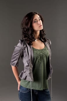 beuatiful young fashion teenager on dark gray