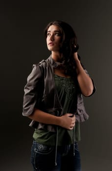 beuatiful young fashion teenager on dark gray